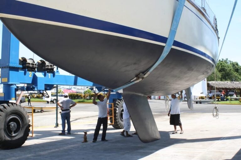 Sailboat hauled out on the travel lift for hull service