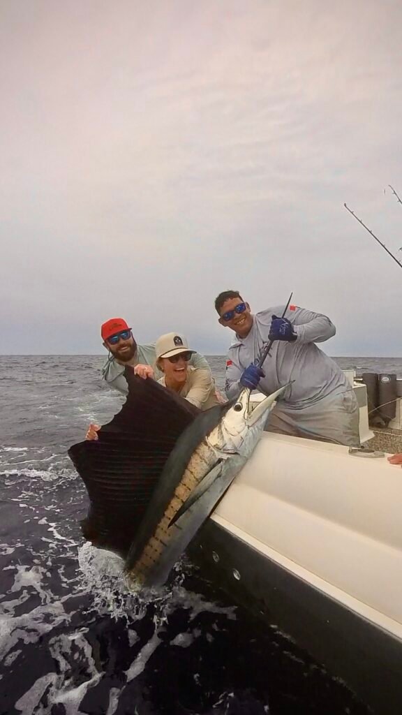 Happy anglers with a sailfish on a Majo charter in Panama